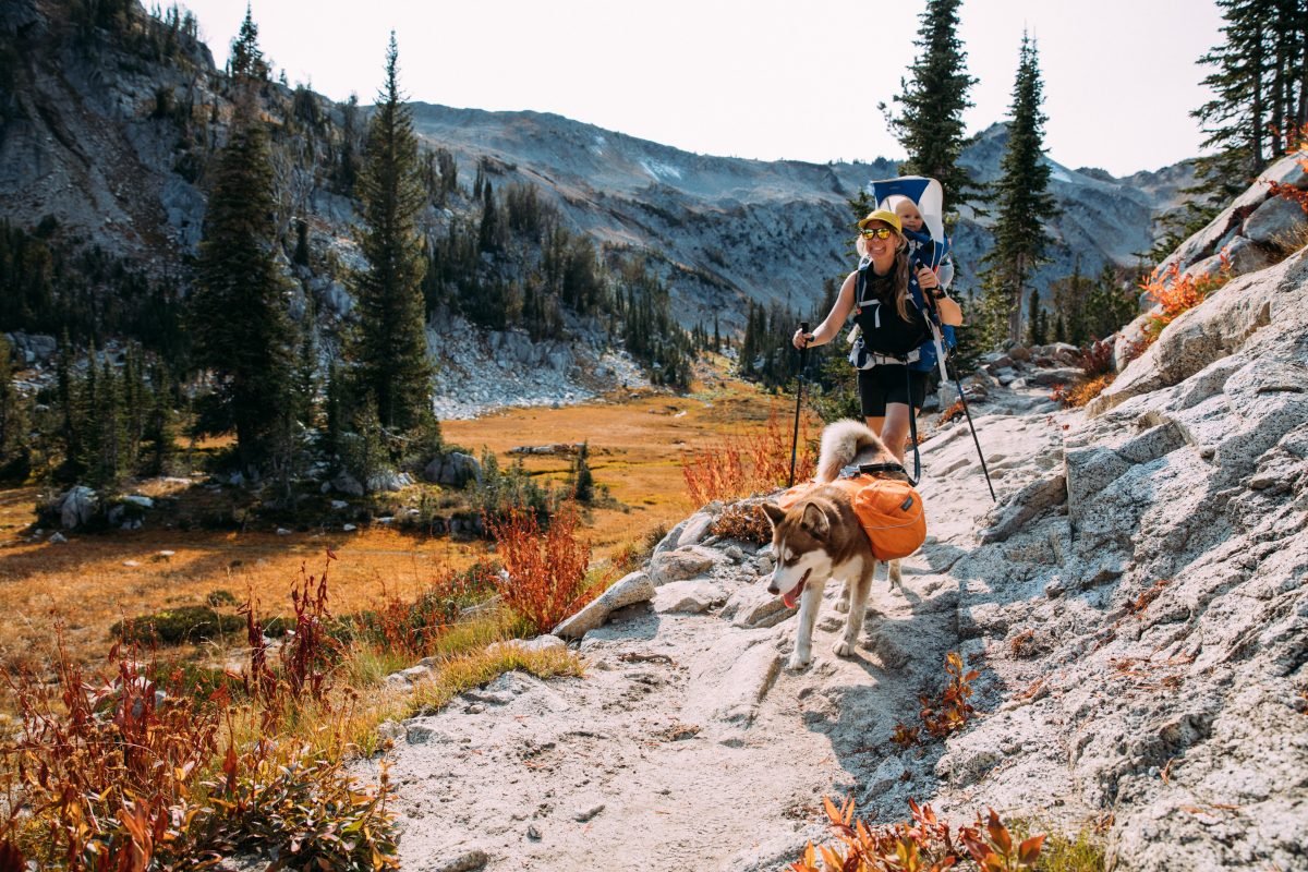 Woman backpacking with her dog