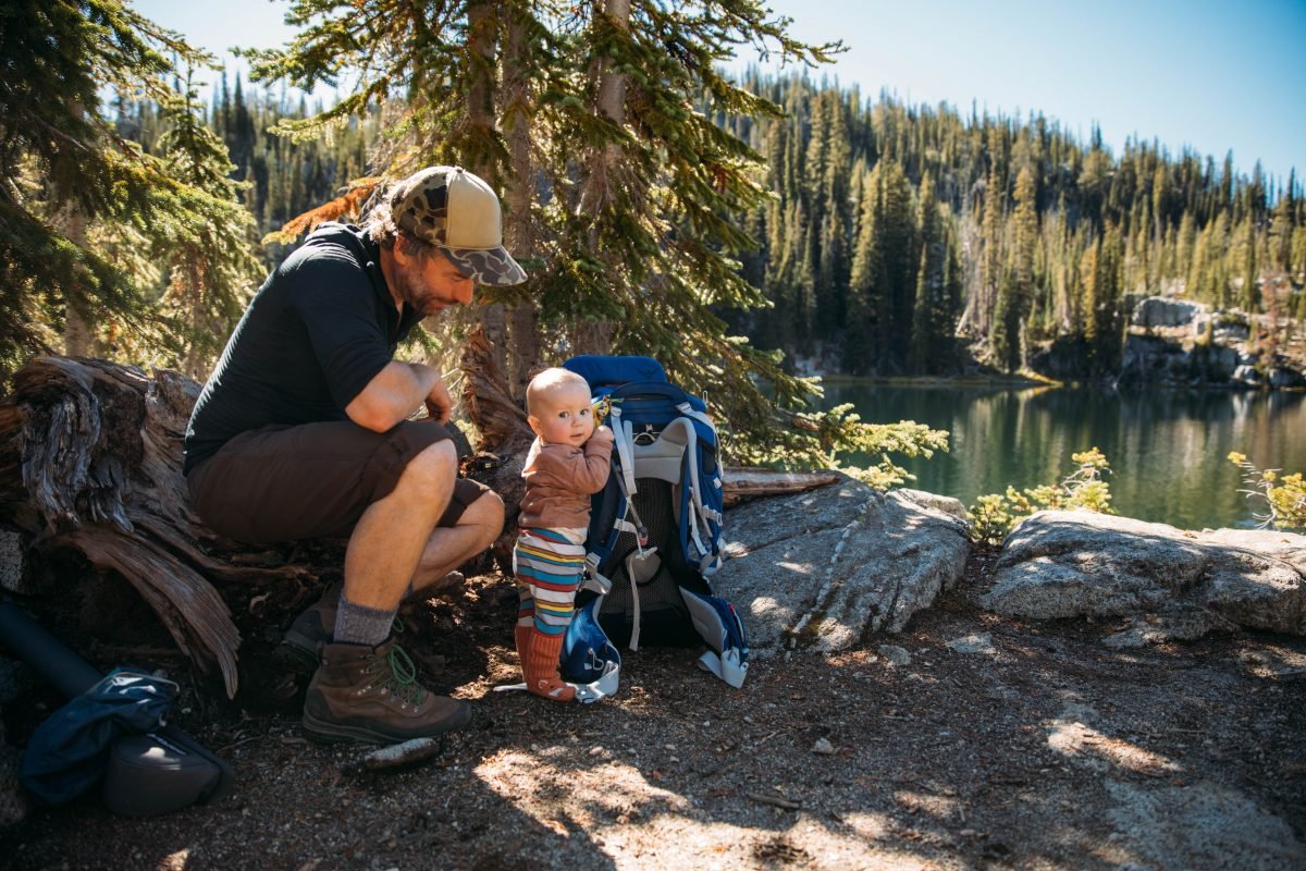 Father and son taking a short break on the trail