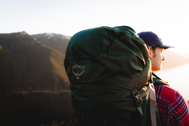 Standing atop Mt. Storm King in Olympic National Park after a sunset hike supported by the Osprey Aether Plus 70 pack.