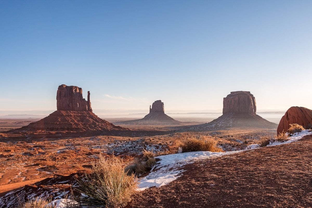 A landscape view of Monument Valley from a distance