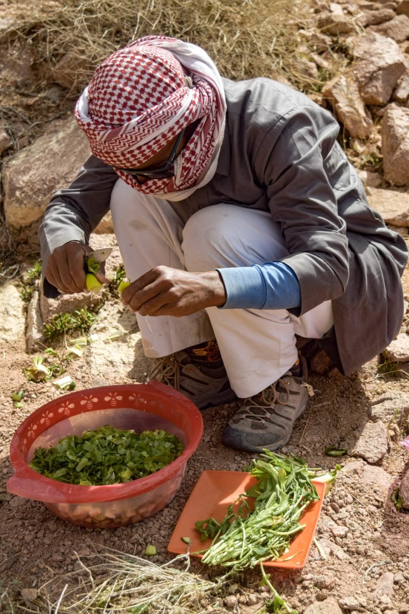 A man prepping a meal along the Sinai Trail