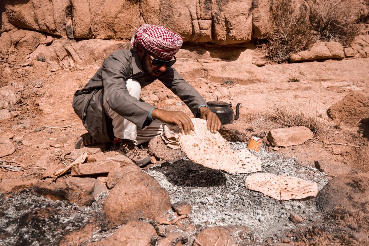 A man prepping a meal along the Sinai Trail