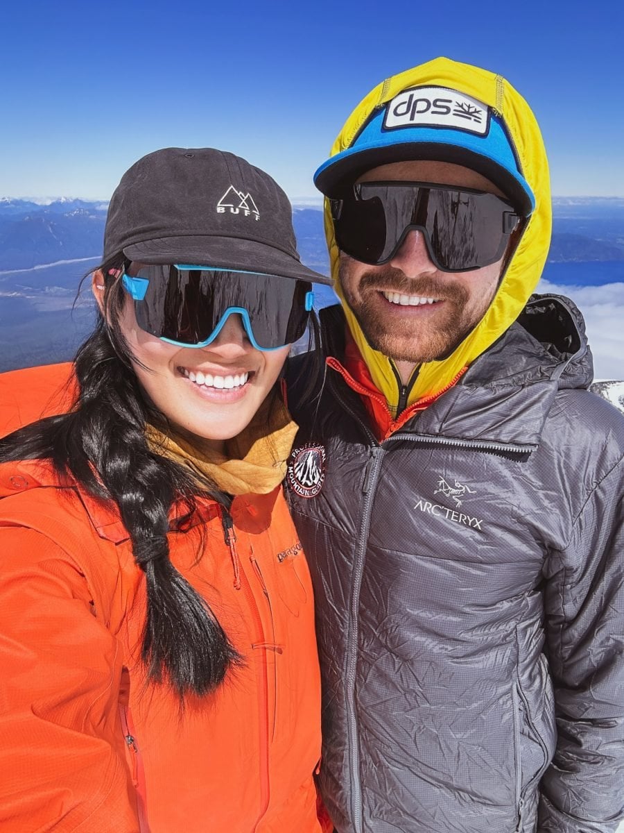 A man and woman in winter gear smiling together