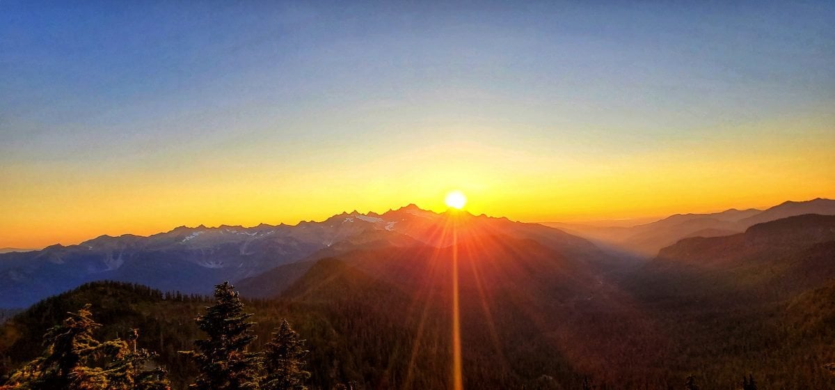 A sunset over a mountain range