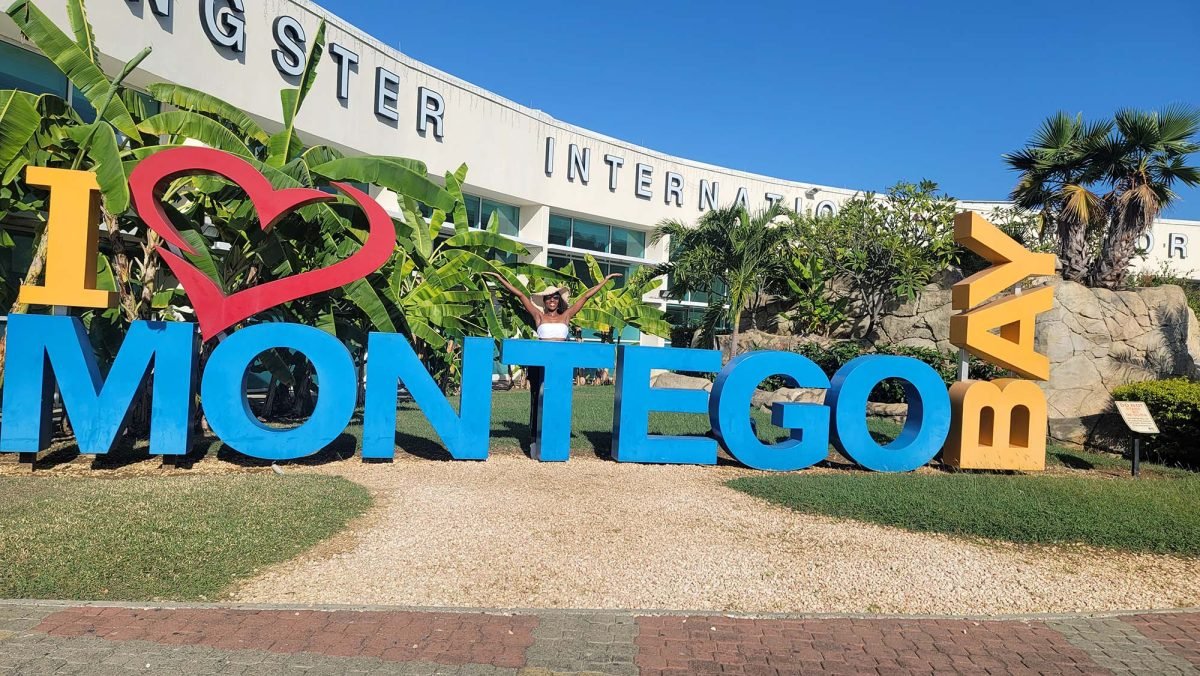 A sign of letters outside of an airport that reads