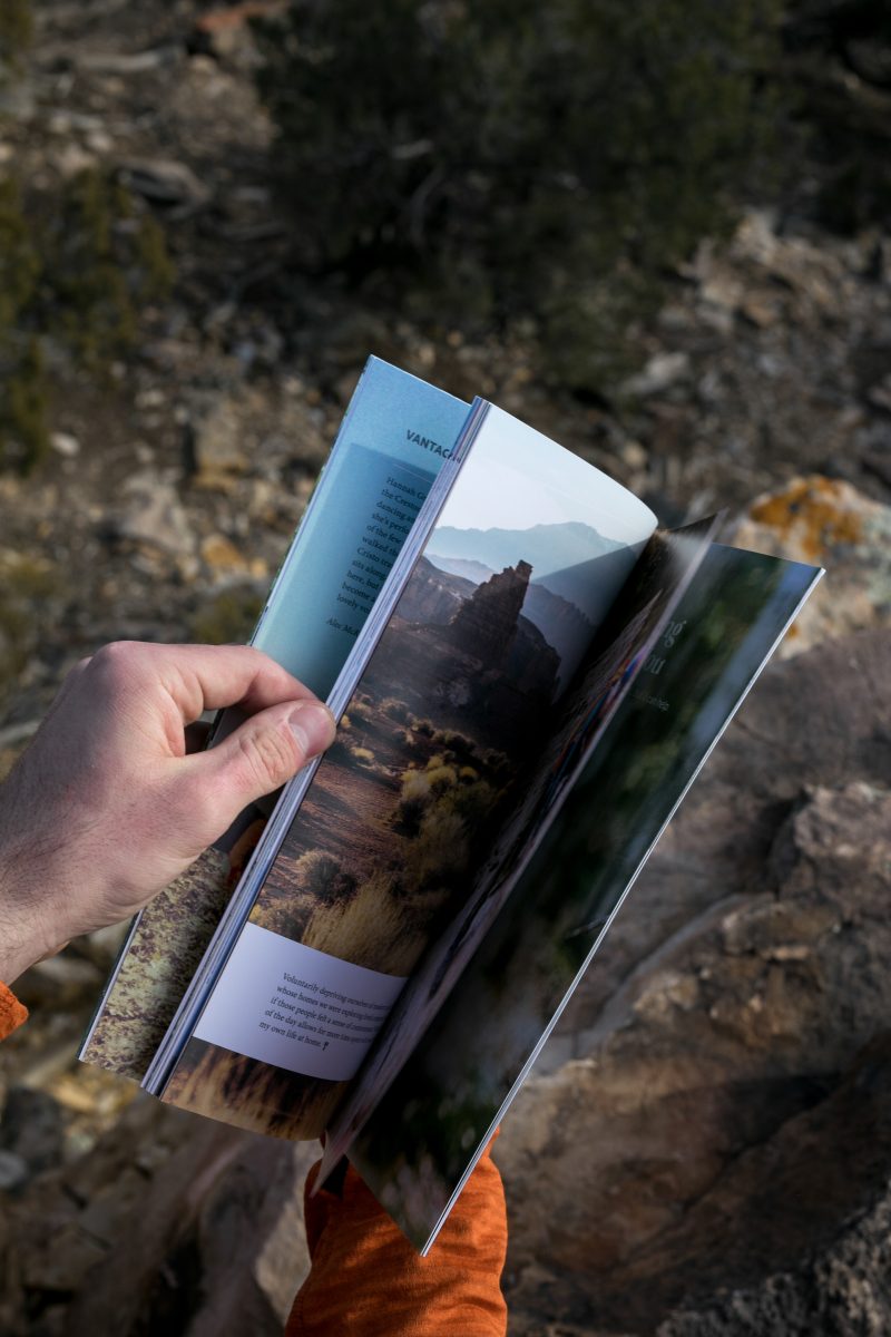 A person paging through a magazine