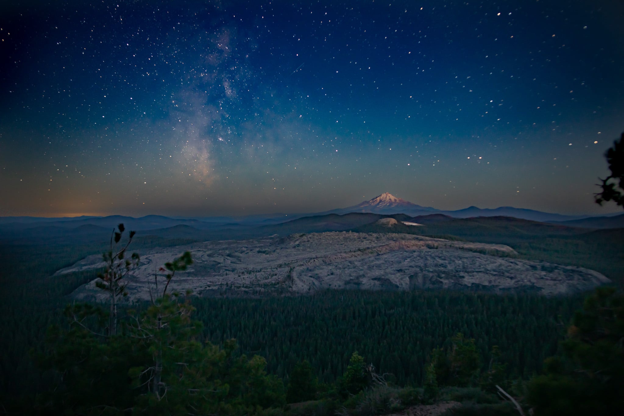 A view of the Medicine Lake Highlands under a starry sky.