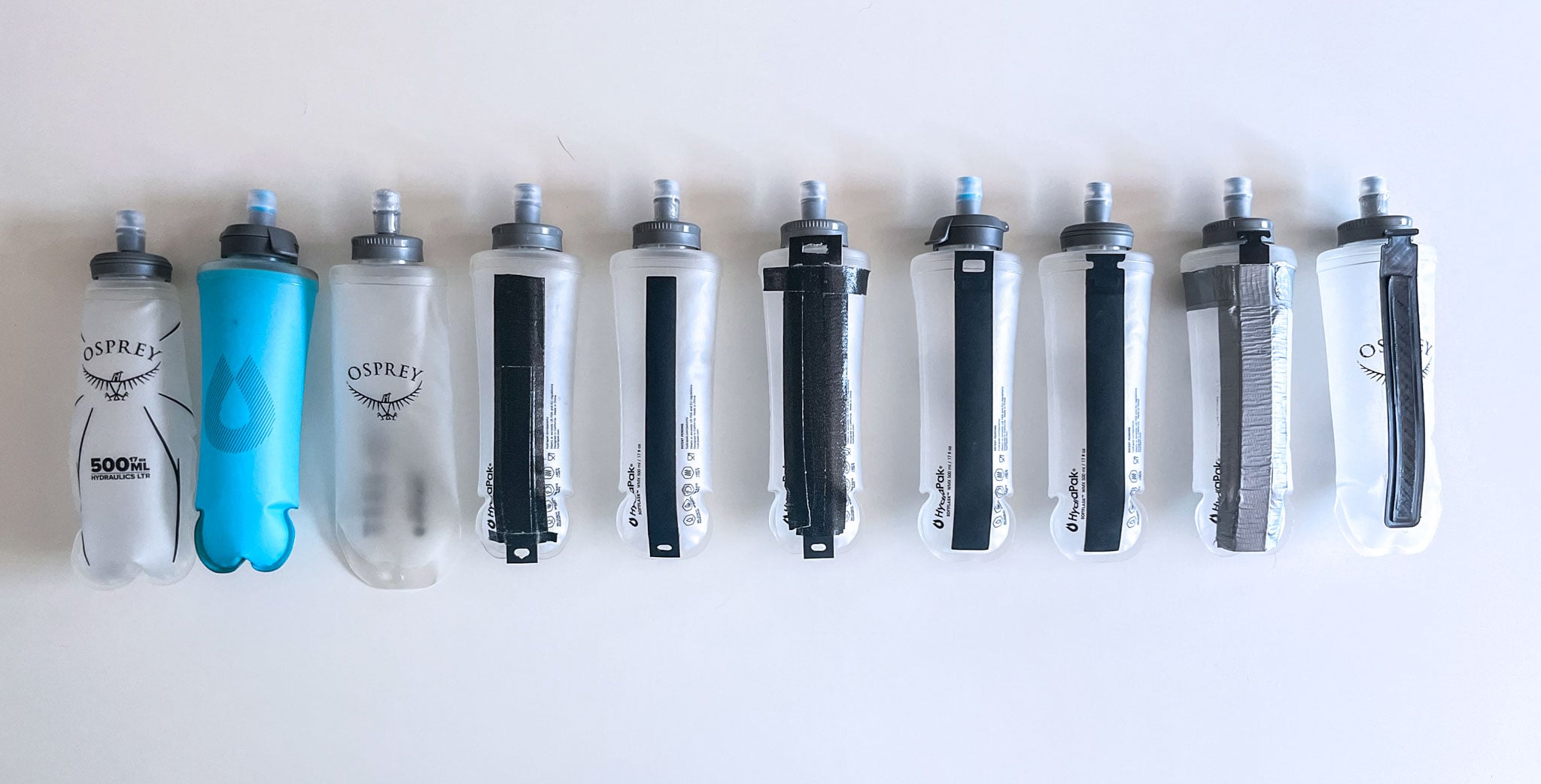 A lineup of water bottle flasks testing out different ways to stabilize.
