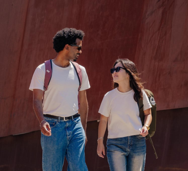 Two people wearing osprey backpacks