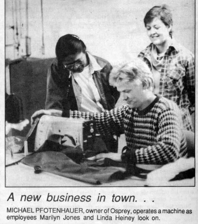 Black and white newspaper clipping with a photo and caption. The photo caption says, &ldquo;A new business in town&hellip; MICHAEL PFOTENHAUER, owner of Osprey, operates a machine as employees Marilyn Jones and Linda Heiney look on.&rdquo;